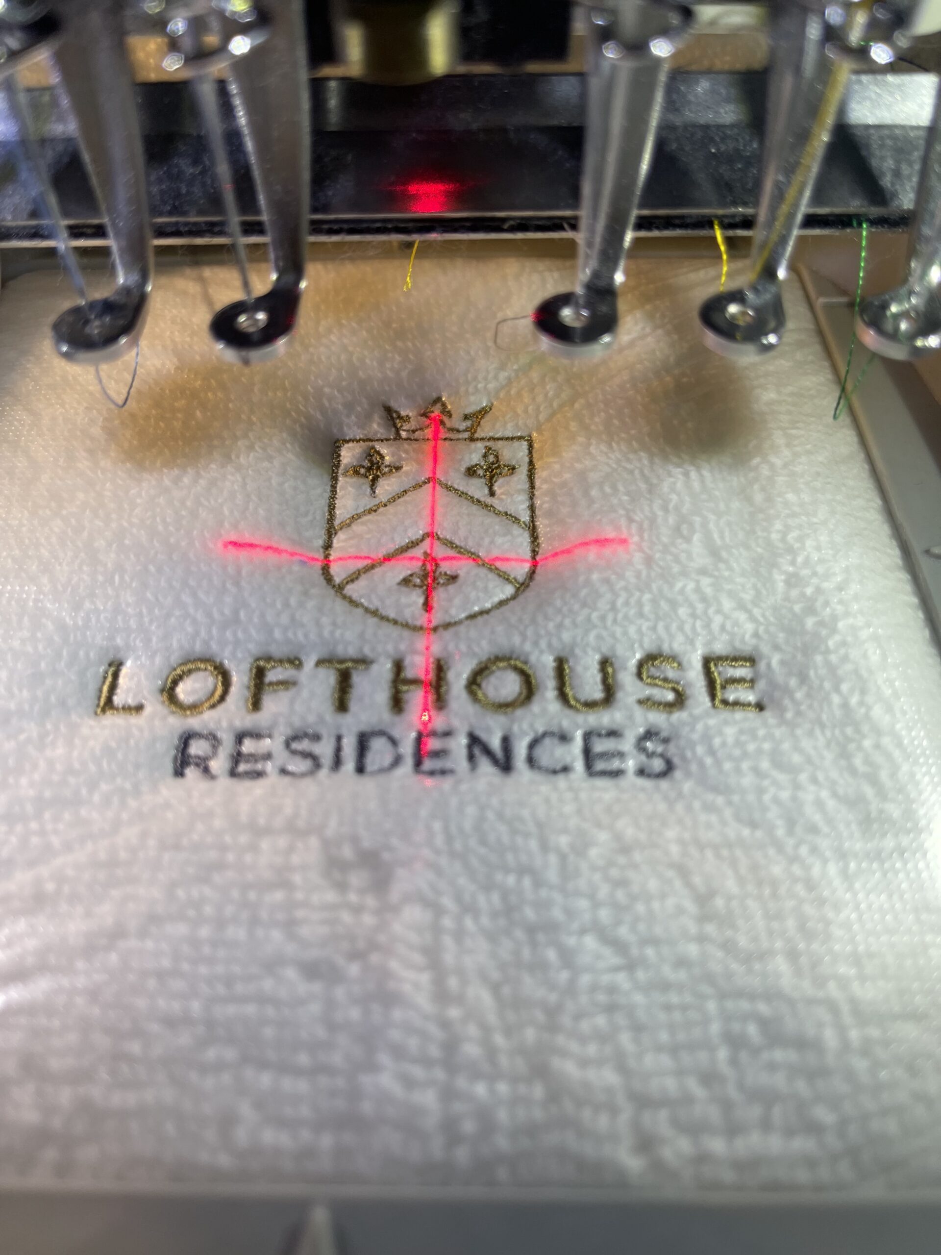 Corporate embroidery being produced by YAPO